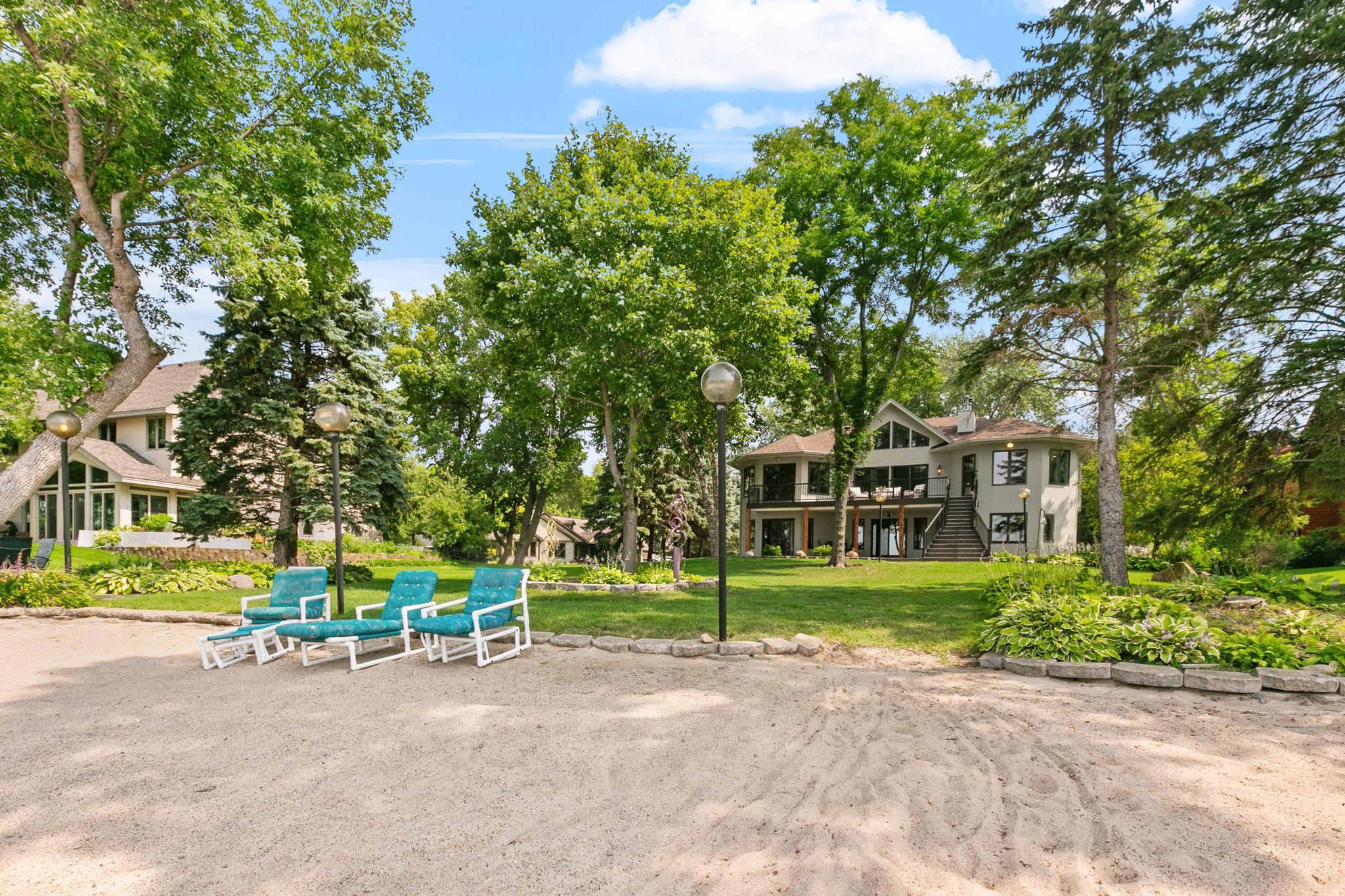 Stunning perennial gardens sprinkled throughout the property and along the beachfront