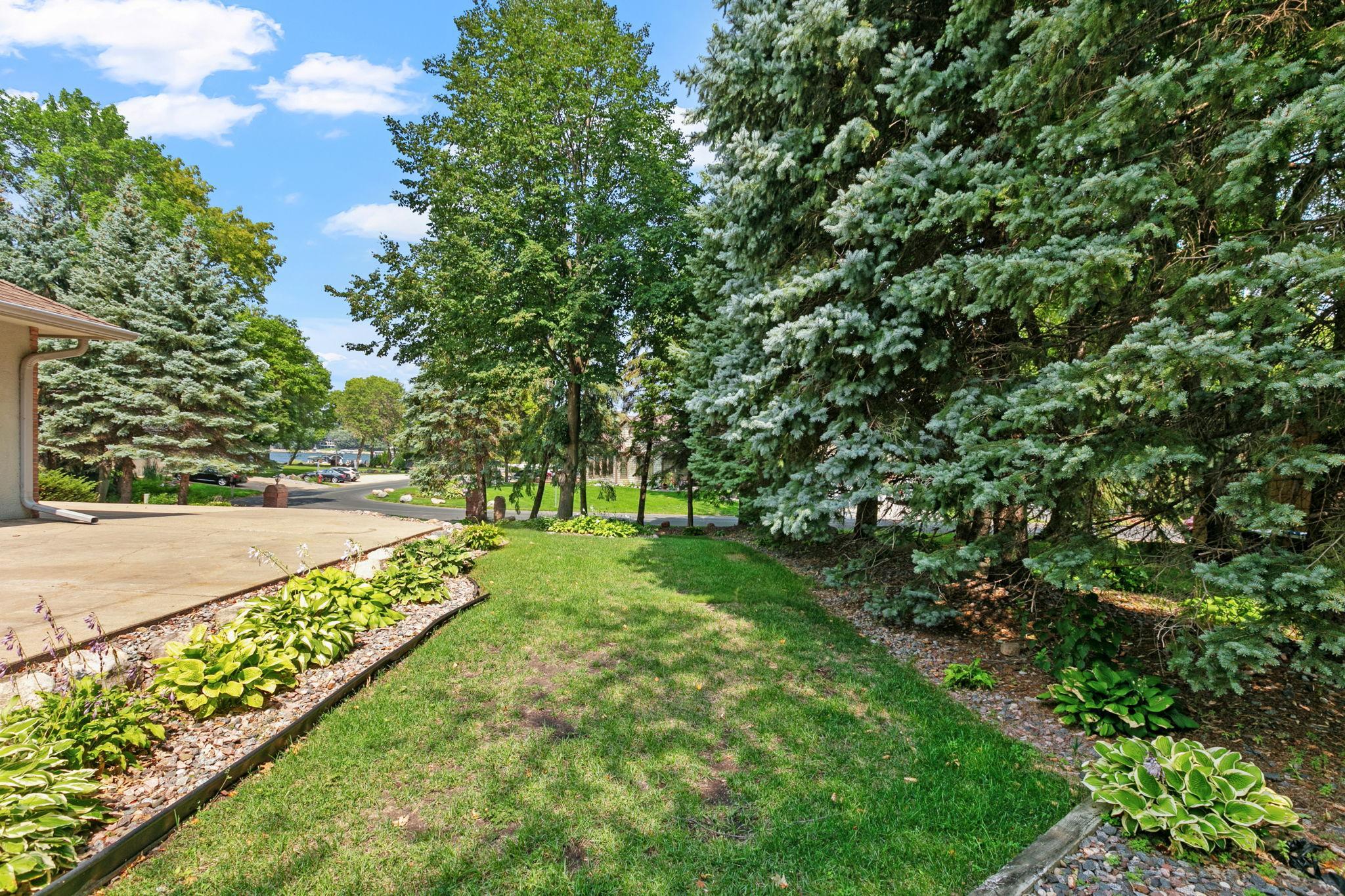 Mature trees and gardens throughout the over 1/2 acre property