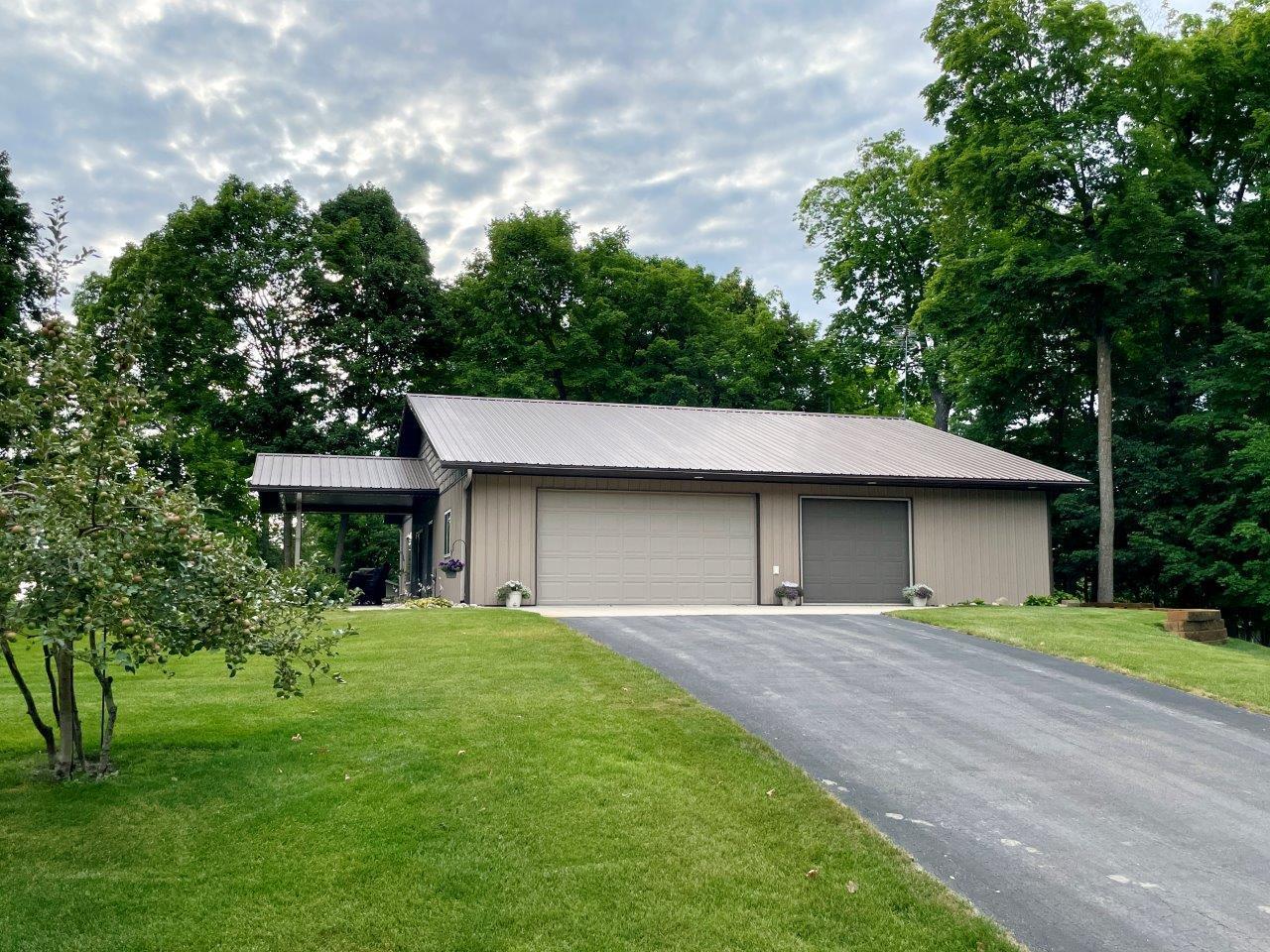 1-Tar driveway and attached 3-car garage