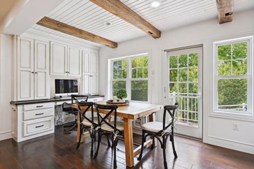 Exposed beams pull the modern rustic feel throughout the main level