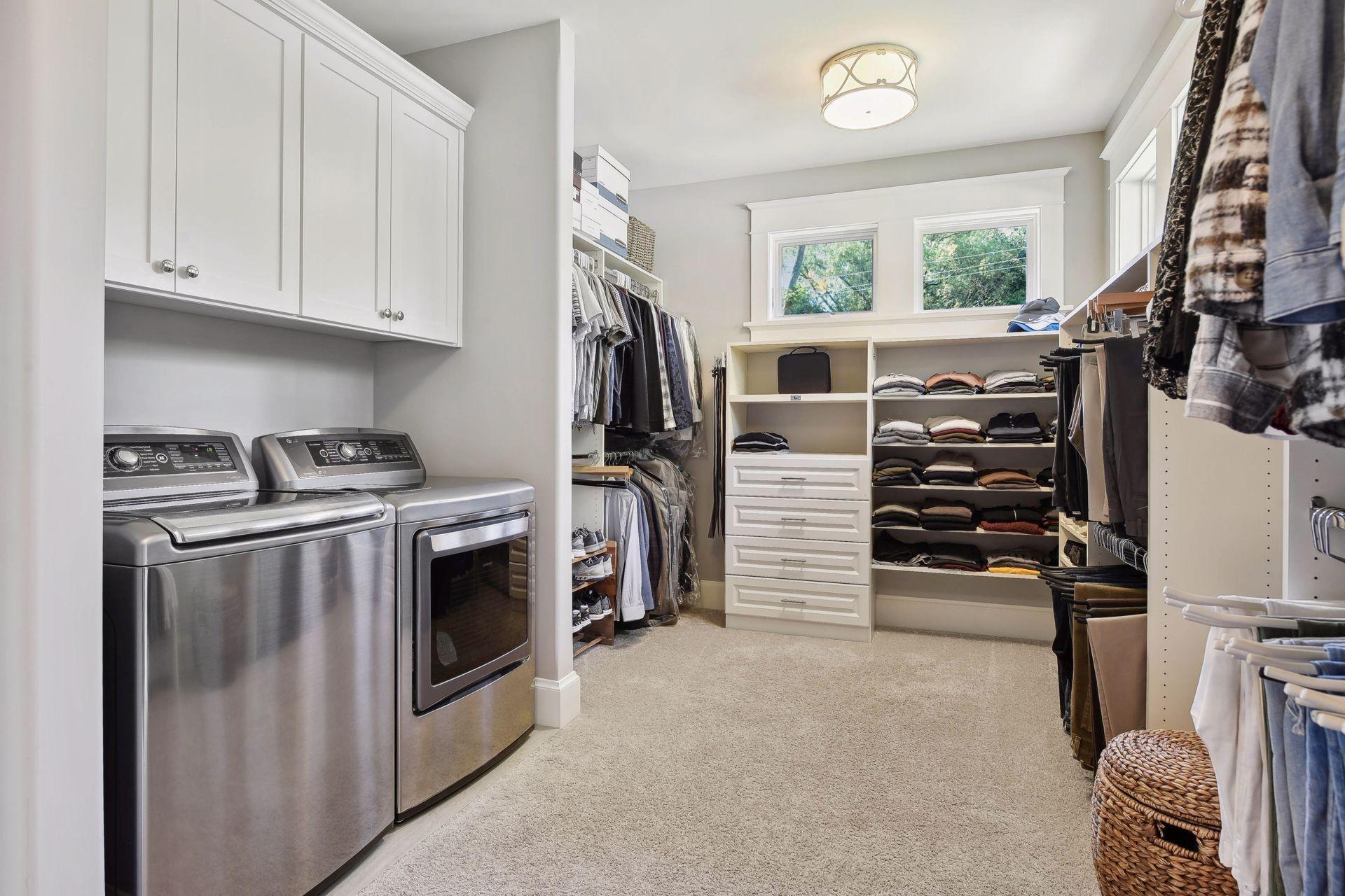 Primary walk-in closet with LG washer and steam gas dryerphoto-0044.jpg