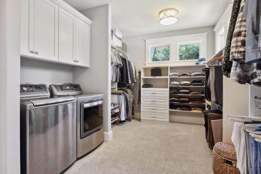Primary walk-in closet with LG washer and steam gas dryerphoto-0044.jpg