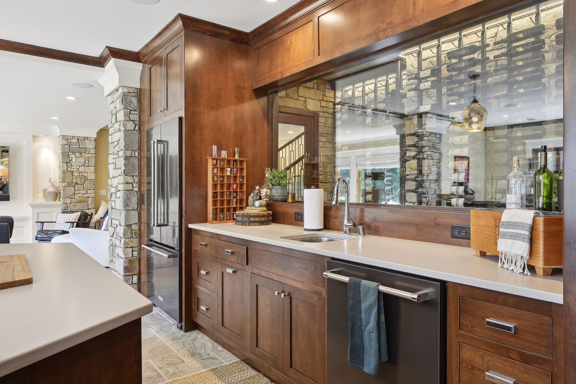 Wet bar with glass window for viewing wine cellar
