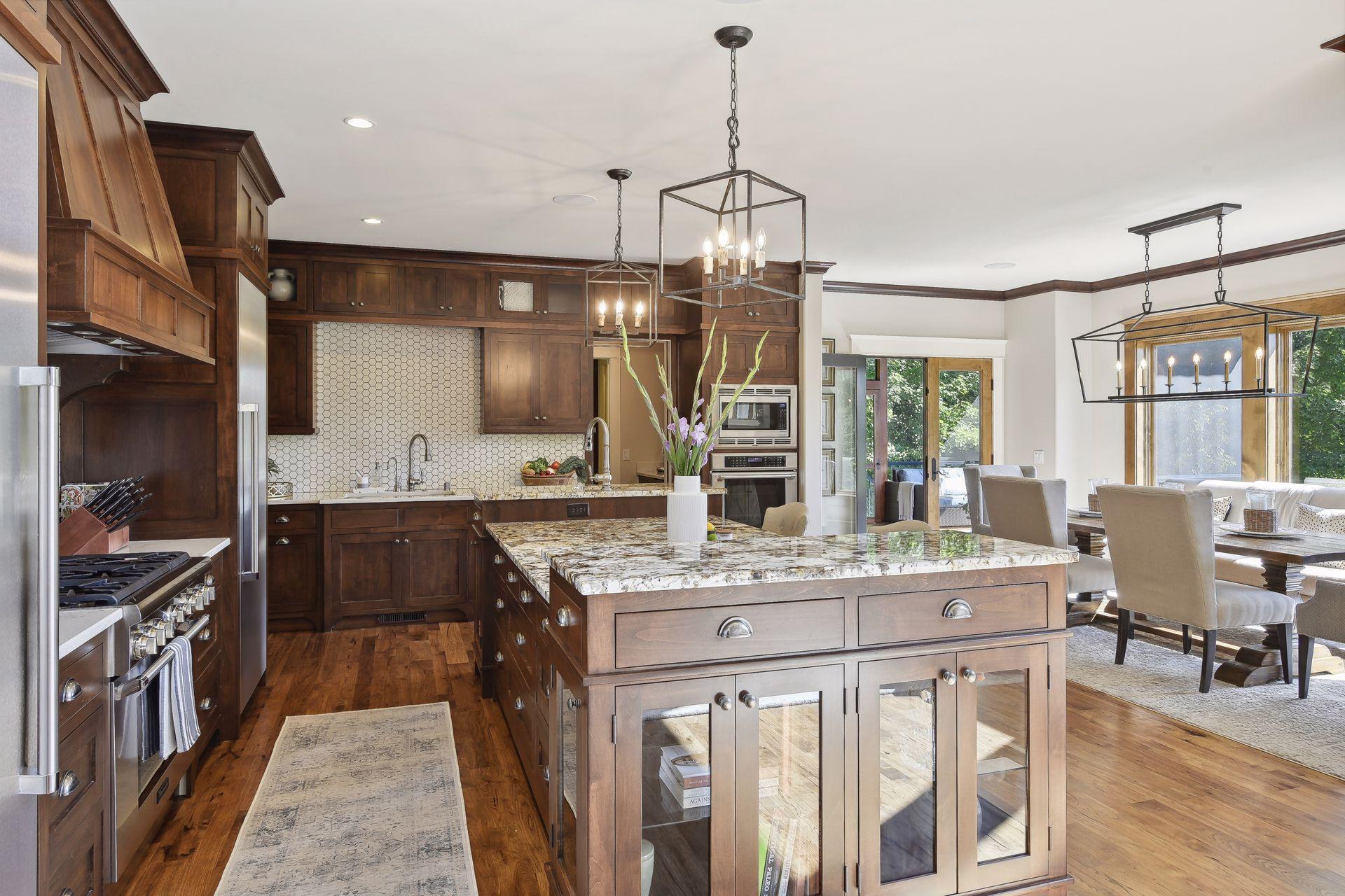 Gourmet kitchen with Thermado appliances, seperae refrigerator and freezer columns, butler pantry with pocket doors, additional prep space and storage, sink, wine cooler and 2nd dishwasher