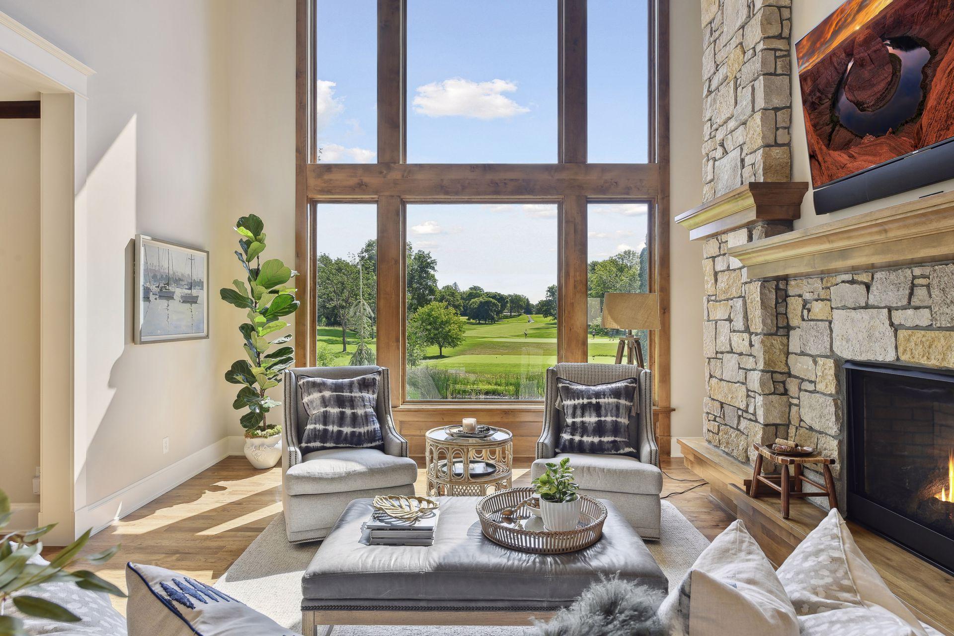 Main floor great room with expansive windows for spectacular views of Wayzata Golf Course. Window tinting for UV protection on east facing windows in great room, kitchen and lower level. Also west facing windows on staircase landing