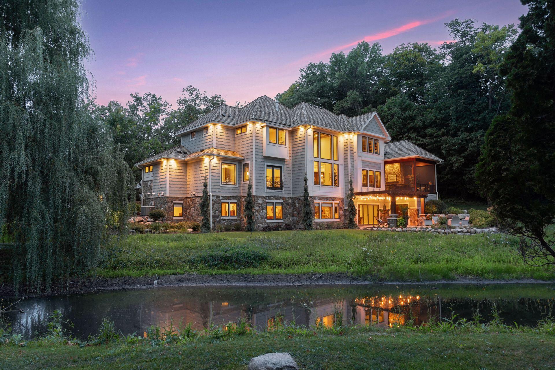 Serene setting with a pond and views of Wayzata Golf Course 10th hole and 11th tee box. Positioned such that golf balls do not reach property.