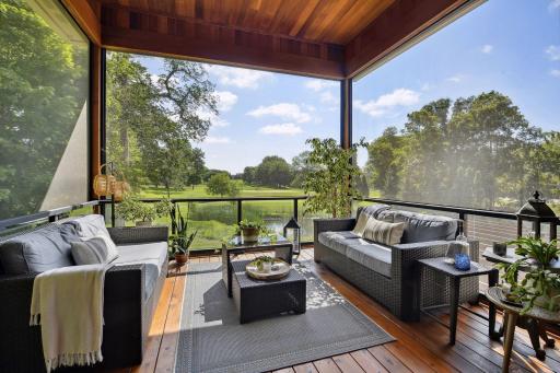 Screen porch has glass rail system, motorized remote controlled screens, celing lighting with dimmers, in-ceiling speakers, grill deck with natural gas hook-up