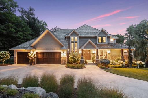 Custom built home with Cedar roof and a heated 3 car garage located on Wayzata Country Club golf course, 10th hole, 11th tee box