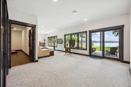 Lots of space in the lower area for entertaining - and a sliding glass door out to a patio.