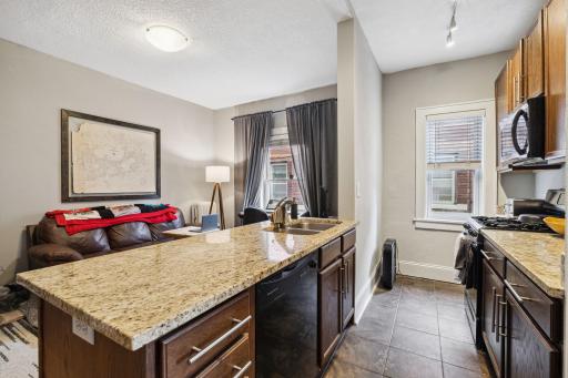 Kitchen was updated when the building converted to condos. Nice counters, cabinets, and tile floors.