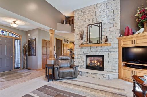 12' floor to ceiling brick double sided gas fireplace with blower.