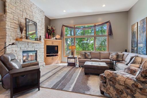 Great room with expansive windows overlooking the deck and backyard.