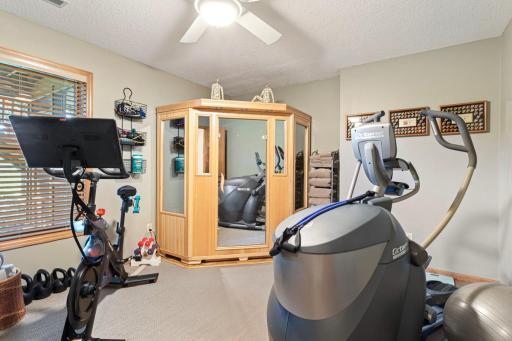Lower level bedroom is currently being used as a workout area with sauna.