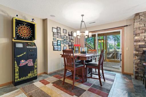 Lower level entertainment area leading to screened porch.