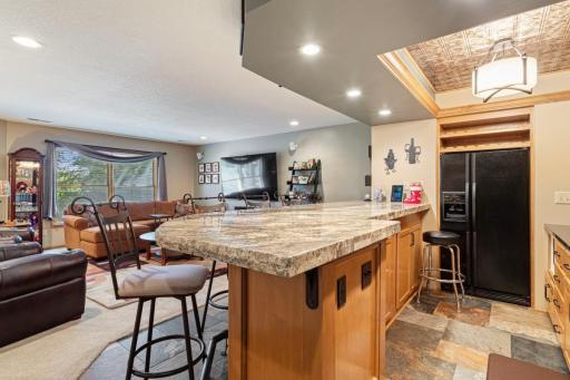 Bar has full sized fridge, microwave, dishwasher.