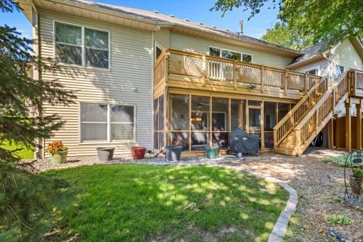 Large deck with entry from dining and main bedroom. Stairs lead to hot tub deck.