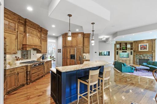 The fantastic gourmet kitchen is equipped with top of the line appliances including Wolf ovens, Blue Star gas range, and an abundance of Alder cabinetry providing excellent storage!