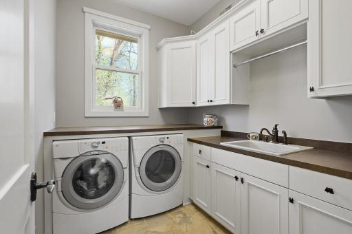 Convenient main level laundry with tons of storage!