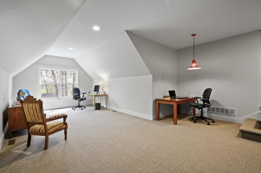 Wonderful bonus space above the garage - fantastic recreation area, workspace, exercise room or whatever you need!