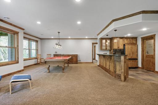 The gaming area has plenty of room to add an additional ping table, shuffle board table or other gaming fun.