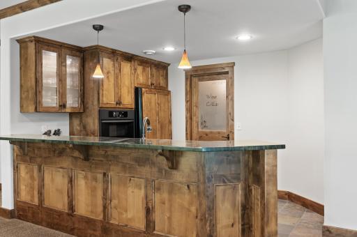 The wet bar is ample for 5+ bar stools and has full size fridge, additional drink fridge and oven/microwave.