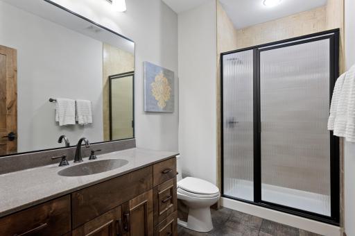 Lower level three-quarter bathroom. Huge storage room located on the lower level too!