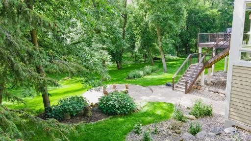 Amazing backyard backs up to a natural wooded area, has a firepit and tons of space to run, play, and entertain!