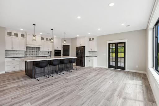 9' ceiling height. Floor to ceiling cabinetry, white enameled trim, black windows and dark stained doors.