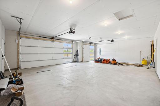 Finished garage, plumbed for gas heater, floor drain, mechanical room