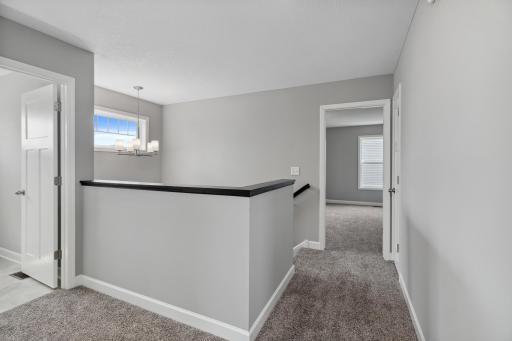 Upper hall landing to 4 bedrooms and Laundry.