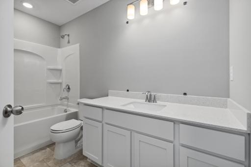 Secondary hall bathroom. Includes vanity mirror!