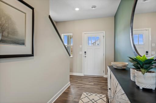 Picture of a model home with the same floorplan and similar features.