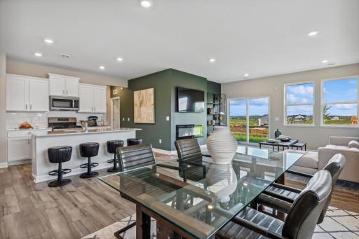 Picture of a model home with the same floorplan and similar features.