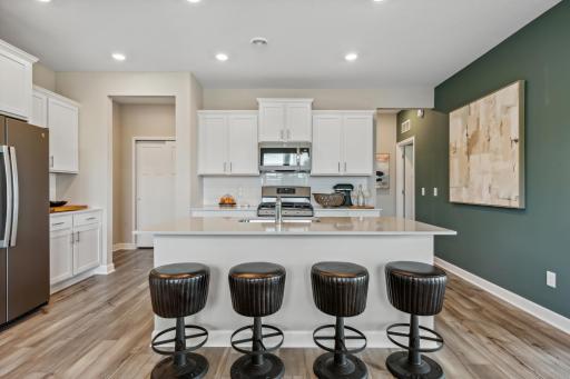 Picture of a model home with the same floorplan and similar features.