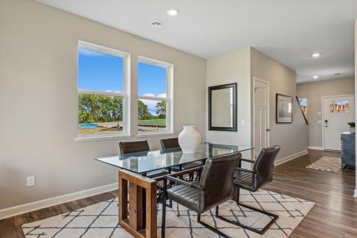 Picture of a model home with the same floorplan and similar features.