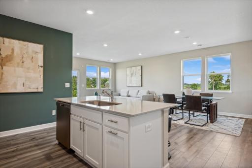 Picture of a model home with the same floorplan and similar features.