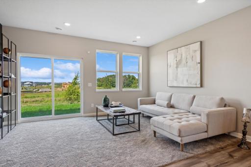 Picture of a model home with the same floorplan and similar features.