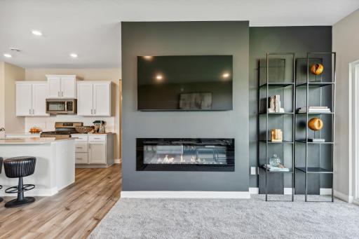 Picture of a model home with the same floorplan and similar features.