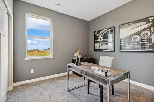 Picture of a model home with the same floorplan and similar features.