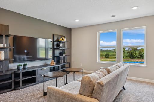 Picture of a model home with the same floorplan and similar features.