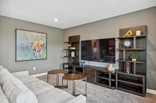 Picture of a model home with the same floorplan and similar features.