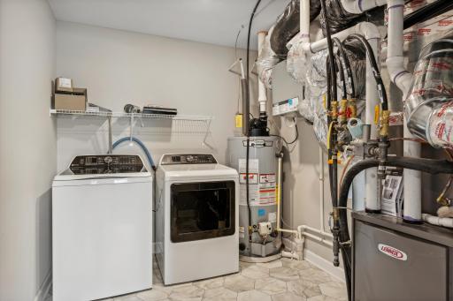 Picture of a model home with the same floorplan and similar features.