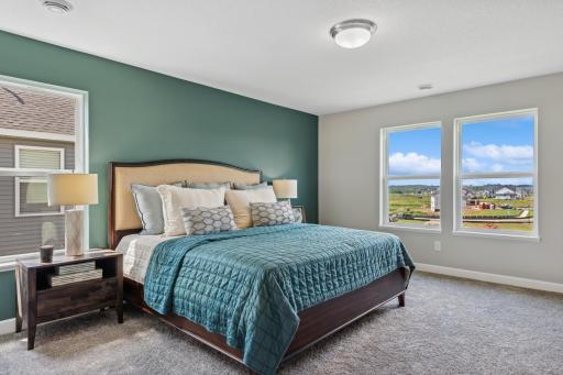 Picture of a model home with the same floorplan and similar features.