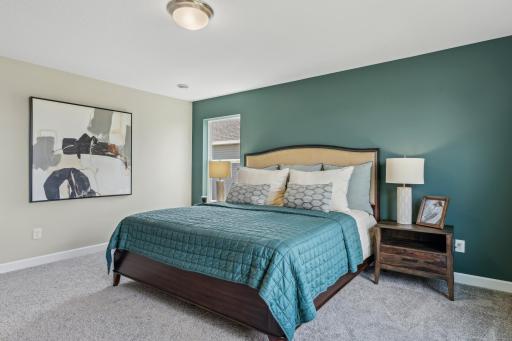 Picture of a model home with the same floorplan and similar features.