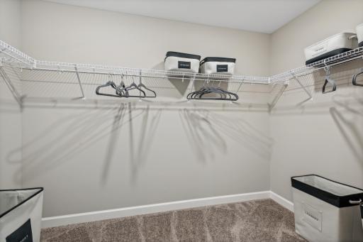 Picture of a model home with the same floorplan and similar features.