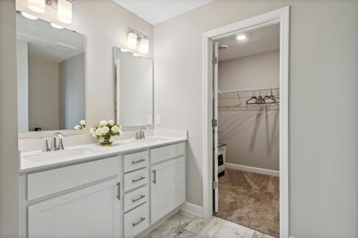 Picture of a model home with the same floorplan and similar features.