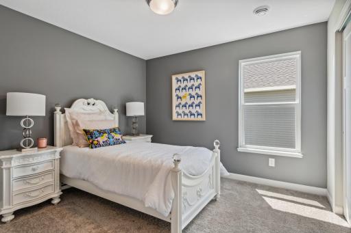 Picture of a model home with the same floorplan and similar features.