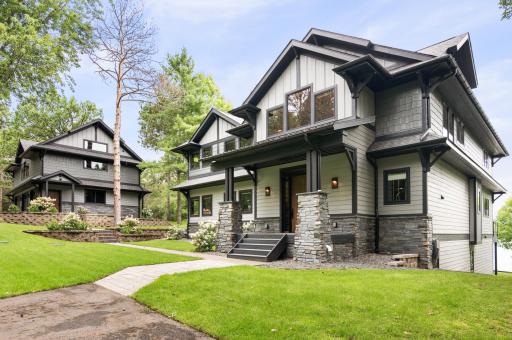 Stunning Upper Gull Lake Home. Detached garage with 1200 sq ft finished above. Sidewalk between the garage and home is heated via the in-floor heat in the garage with a moisture sensor in the sidewalk.
