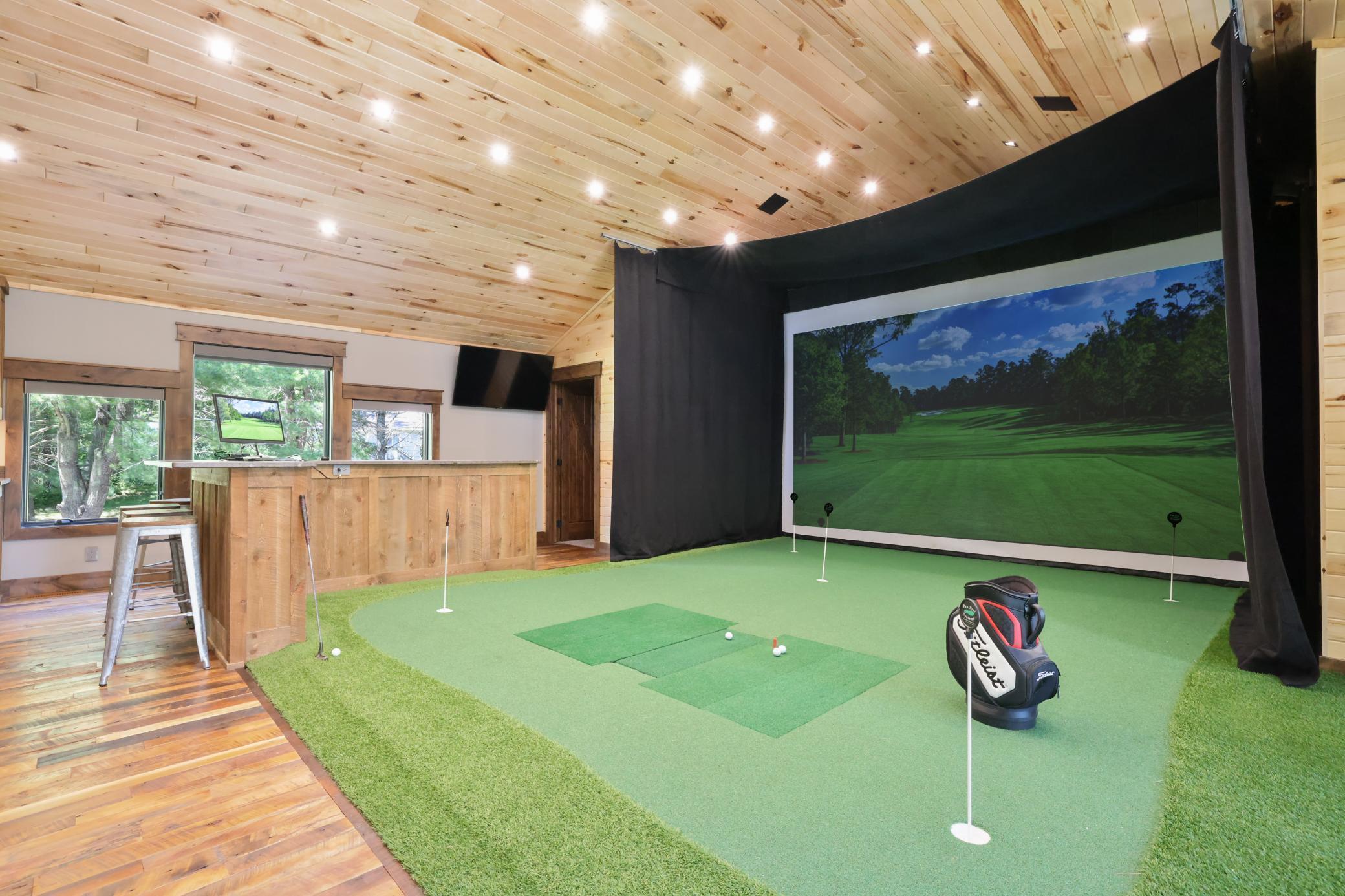 Golf Simulator located above the garage heated by in-floor and forced air heat. Also connect to A/C!