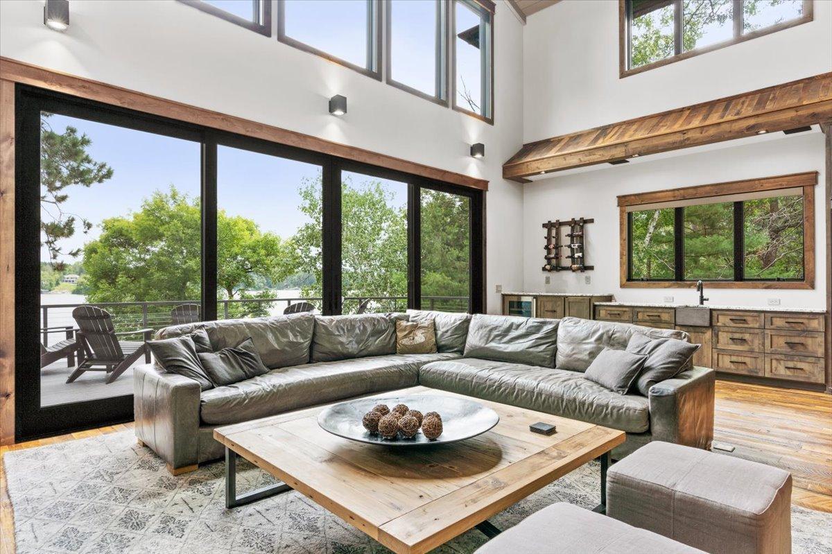 The living room features a massive, double sliding glass door that provides plenty of open air access to the deck.